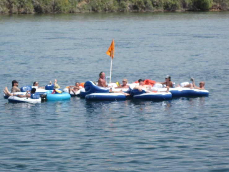 an image of people floating on inflatable rafts