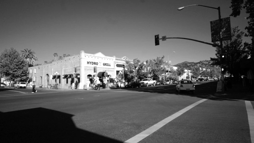 black and white pograph of the intersection of a city street