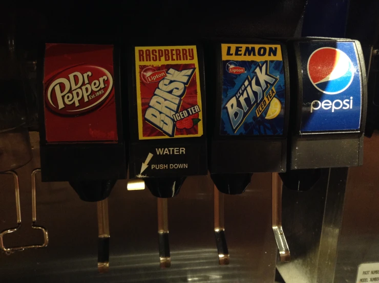 soda machines lined up next to each other