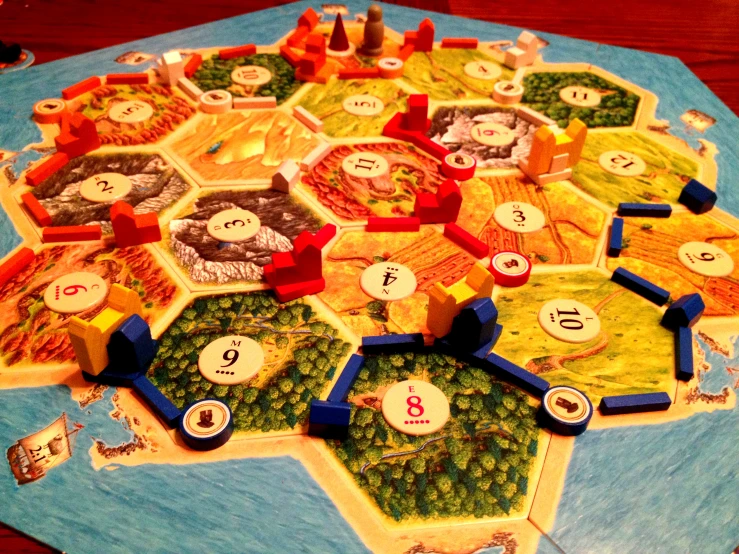 the game of settlers and settlers is laid out on a table