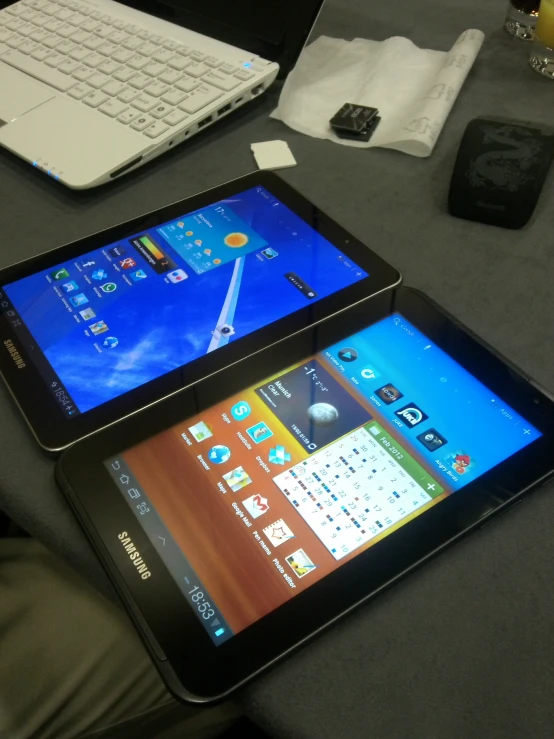 a tablet computer, and tablet - pc displayed on a table