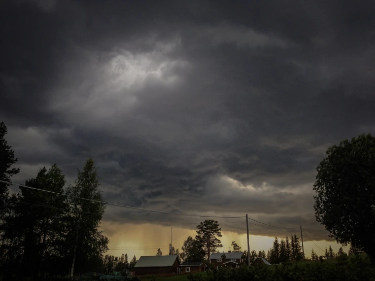 storm clouds in the sky over a building