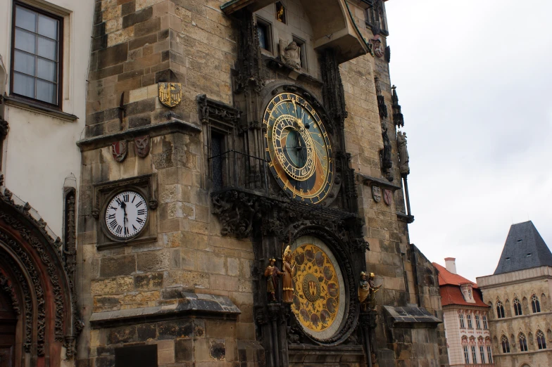 an ornate clock tower with intricate carvings on the front of it