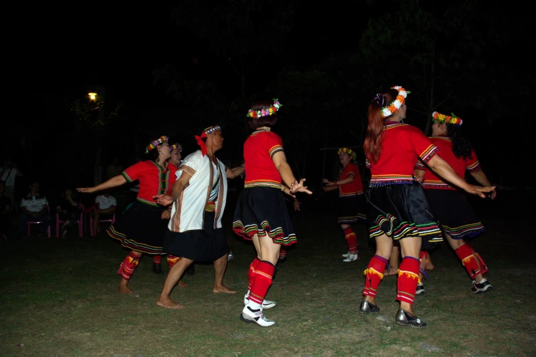 some men are in costume dancing around