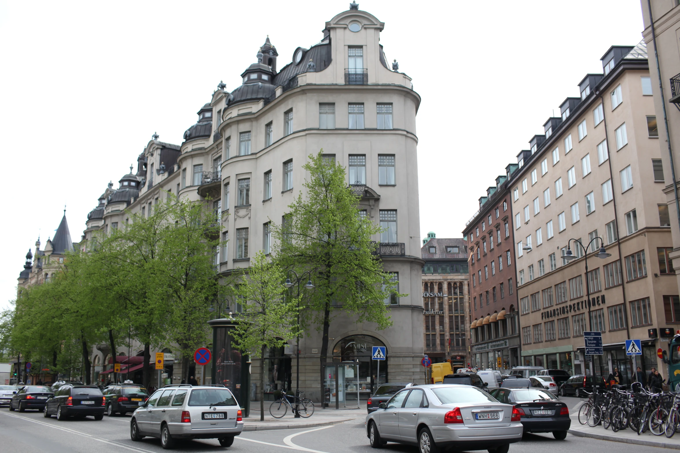 traffic in an urban setting is shown along the street