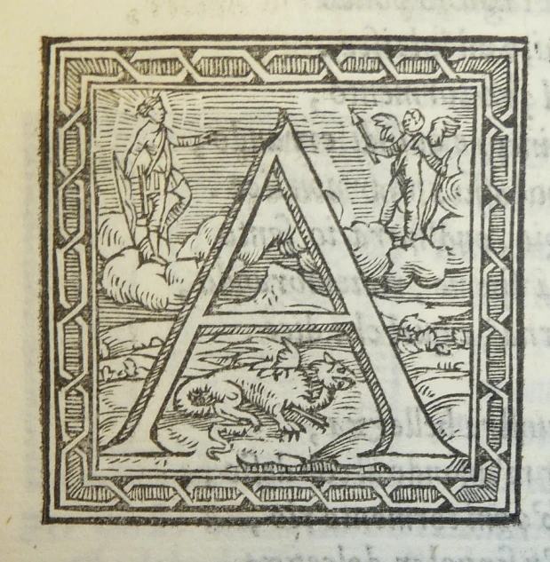 an antique book with a black and white image of a triangle