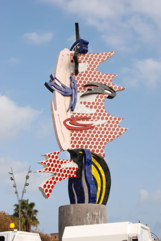 a very large colorful statue made out of various types of objects