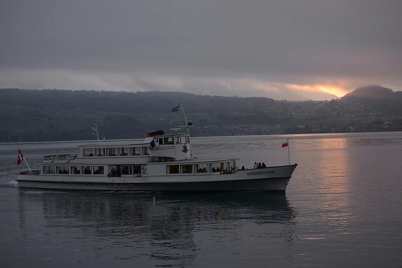 a ship is traveling on a body of water