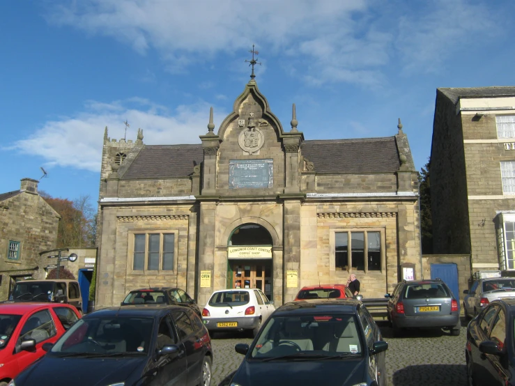 a church with cars parked in front of it