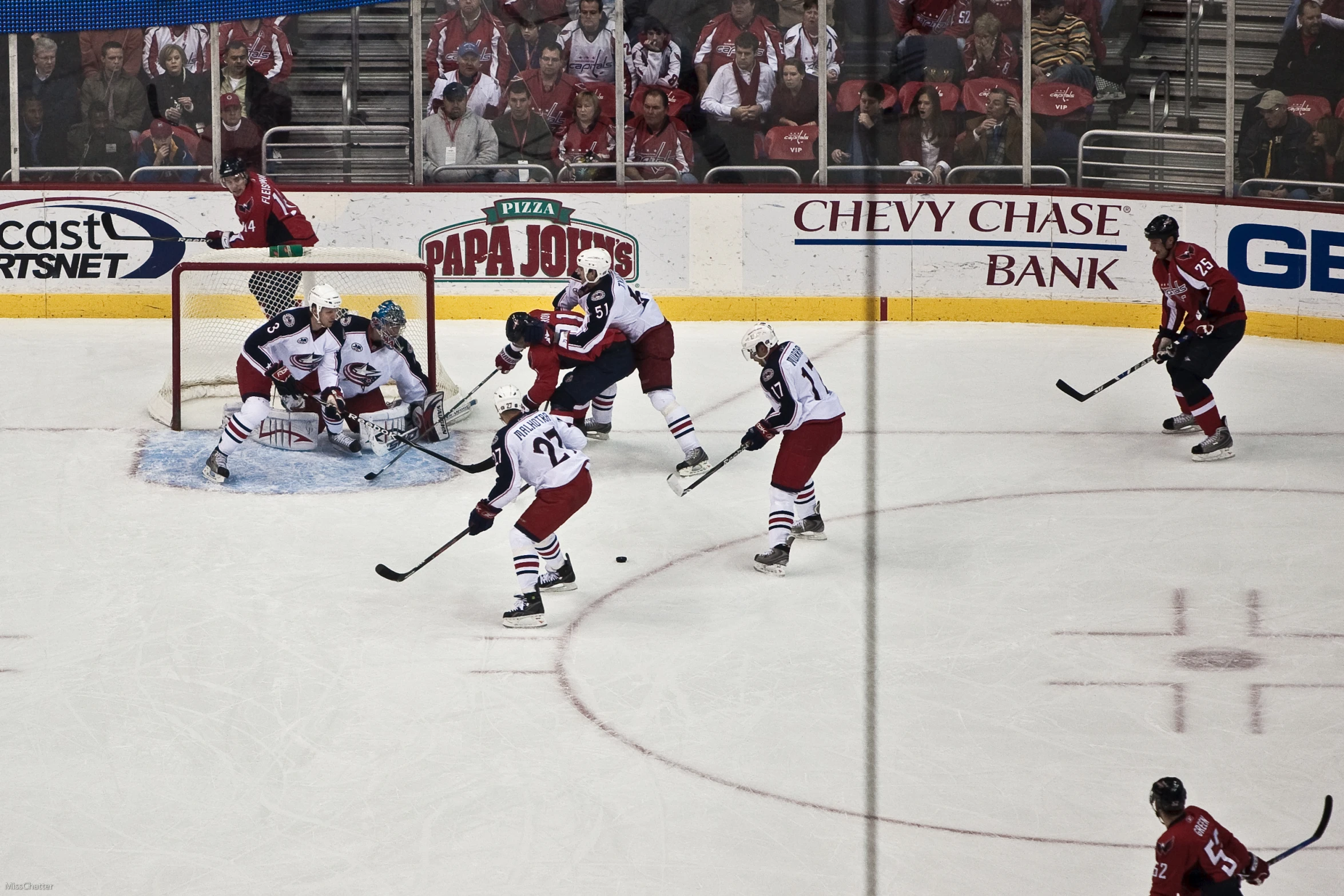 a hockey game going on in the rink