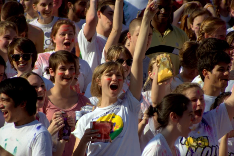 a group of people standing in front of a crowd