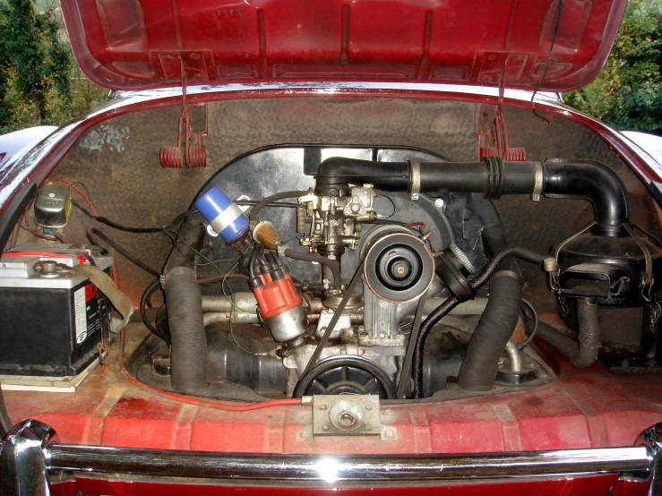 a car trunk with pipes and motorbikes inside it