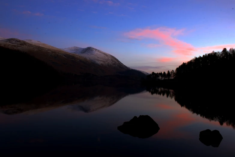 a scenic image of the mountain lake during the sundown