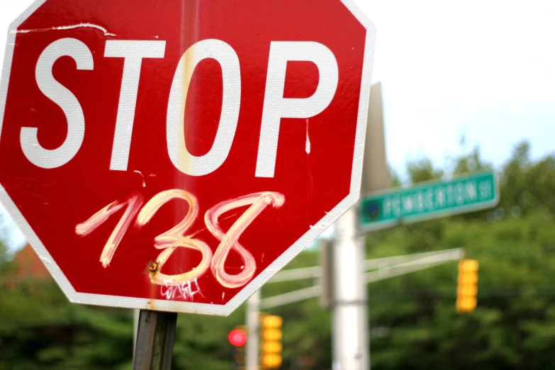 a stop sign has some writing on it