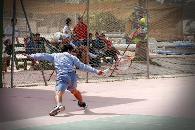 a tennis player swinging at a tennis ball