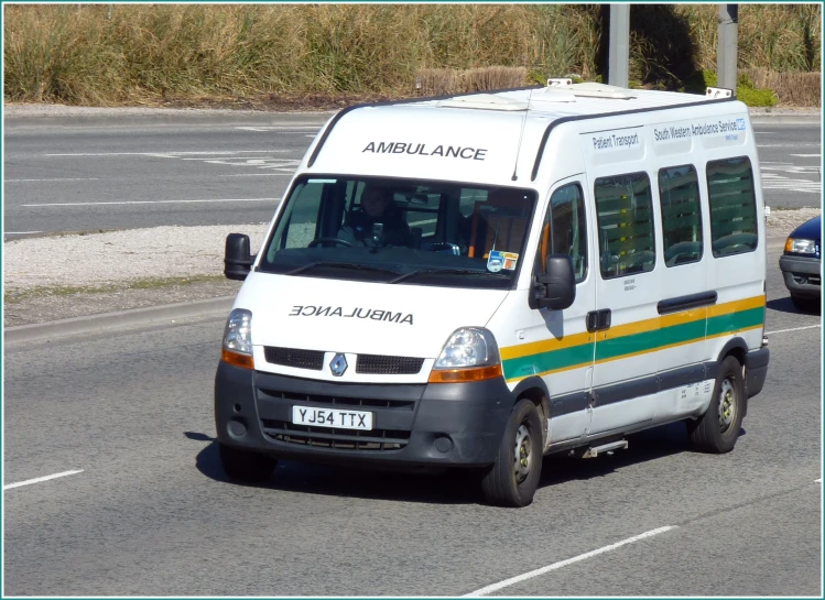 a white van driving down the street with an american force sign on it