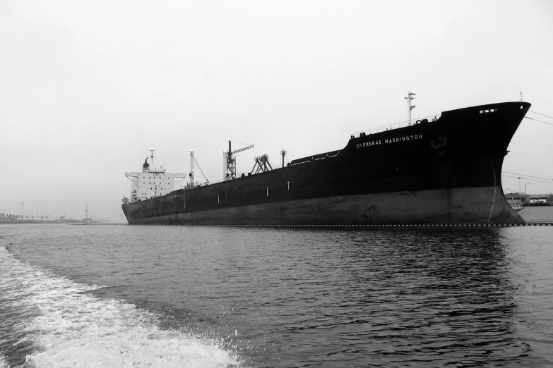 black and white image of a large boat in the water