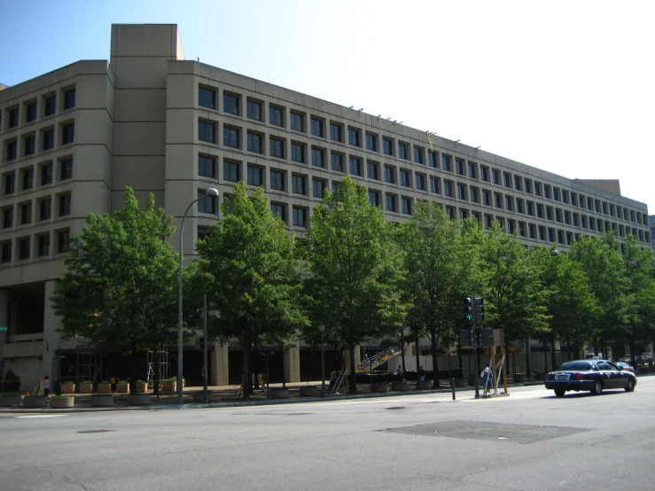 a large building that is on the corner of the street