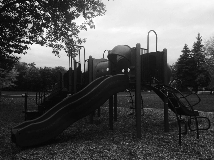 an outdoor playground with a water slide