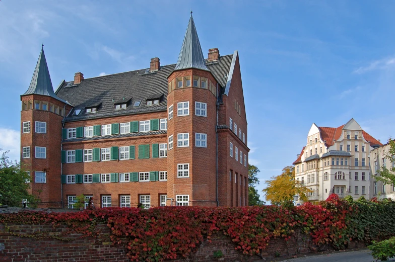 a tall red brick building with many windows