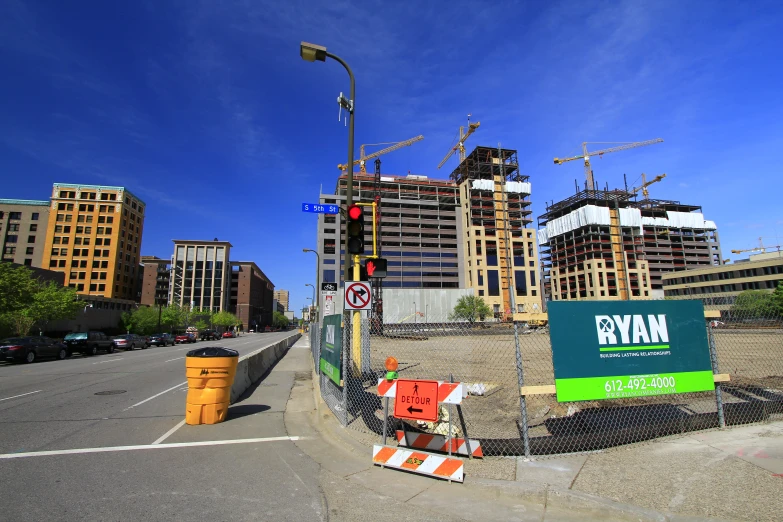 a large urban city with construction and street signs