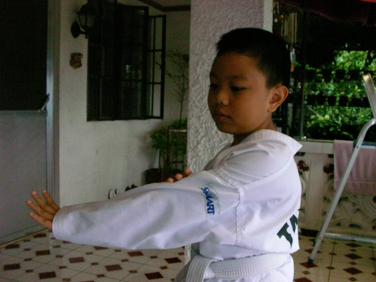  in white uniform playing martial