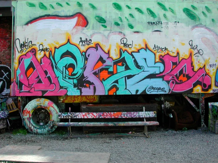 an old truck with graffiti on it is parked