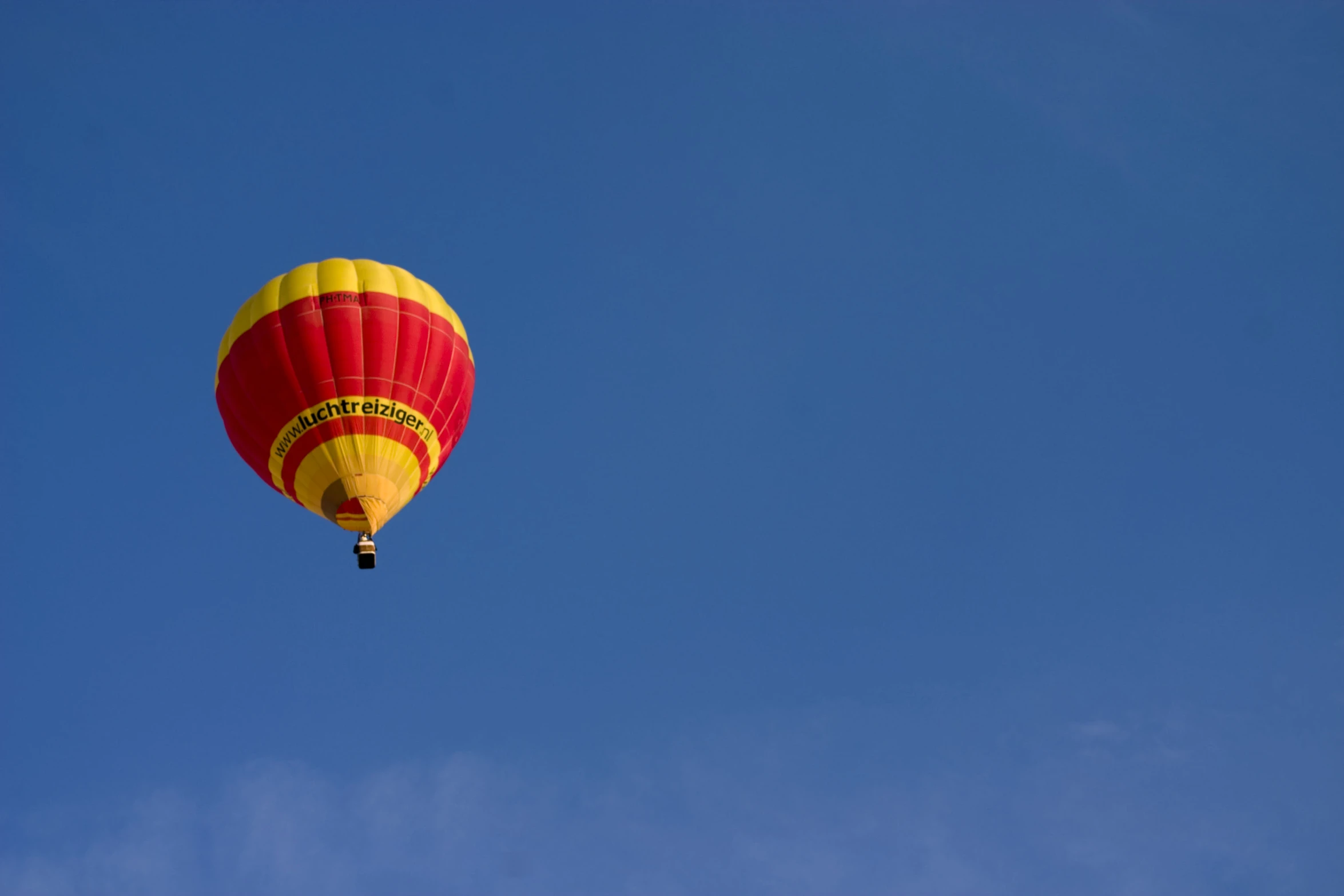 a  air balloon is in the air on a clear day