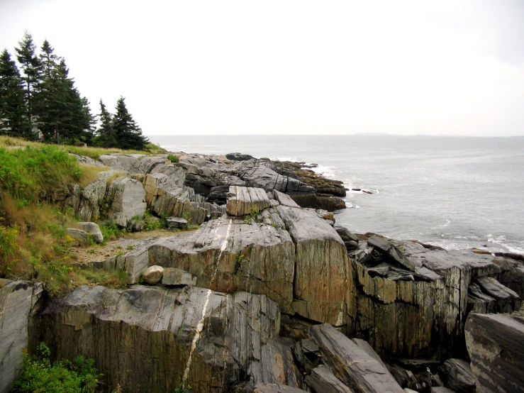 an island with a couple of rocks in the foreground