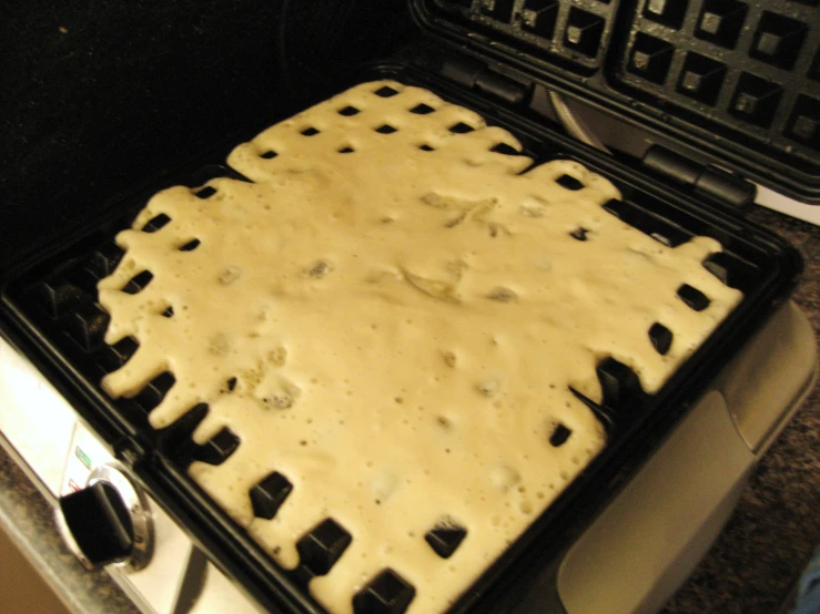 the large square pan of cake is resting on the stove