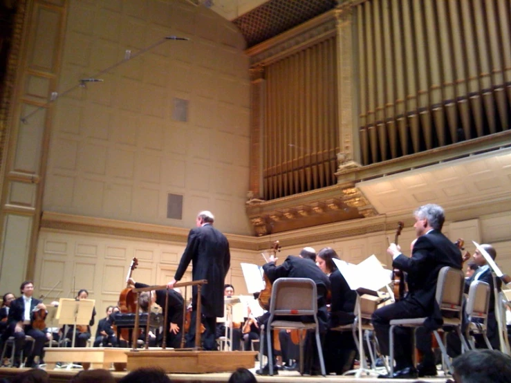 a group of men on stage with instruments