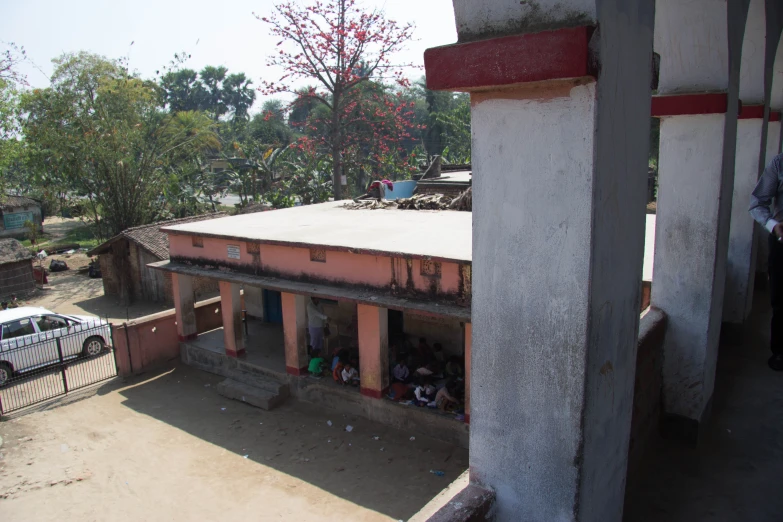 a small building with many small children inside it