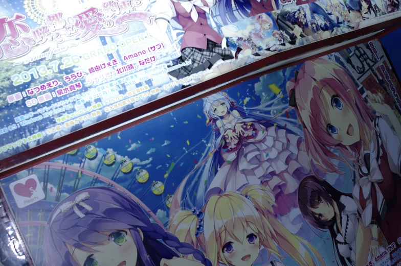 a set of anime themed posters are on display