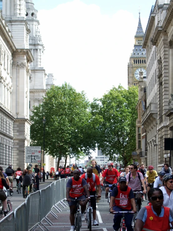 people riding bicycles on a city street