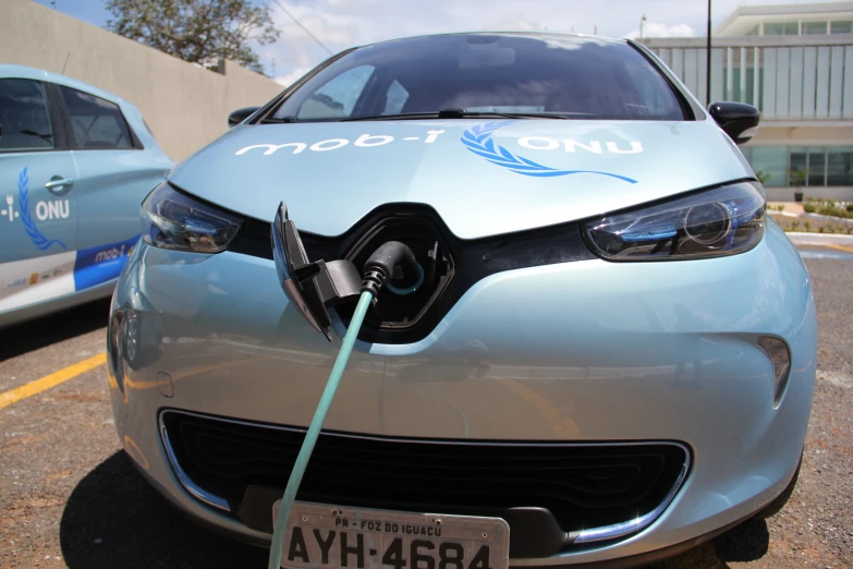 an electric car is charging at a no - electric power station