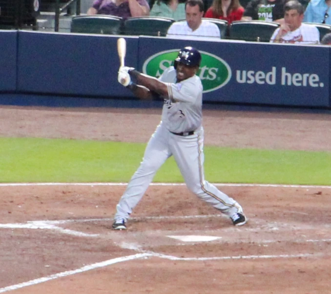 a baseball player is in action with the bat