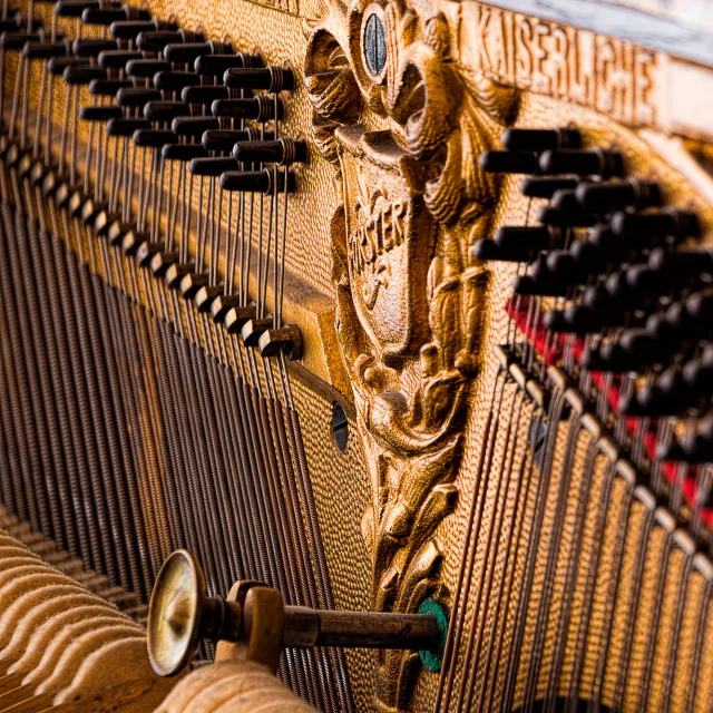 the strings on a piano are intricately carved