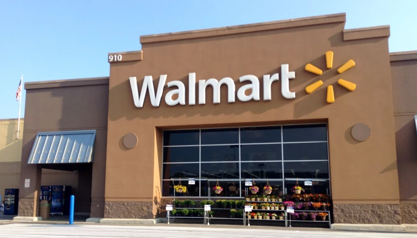 the facade of a walmart store with many items inside