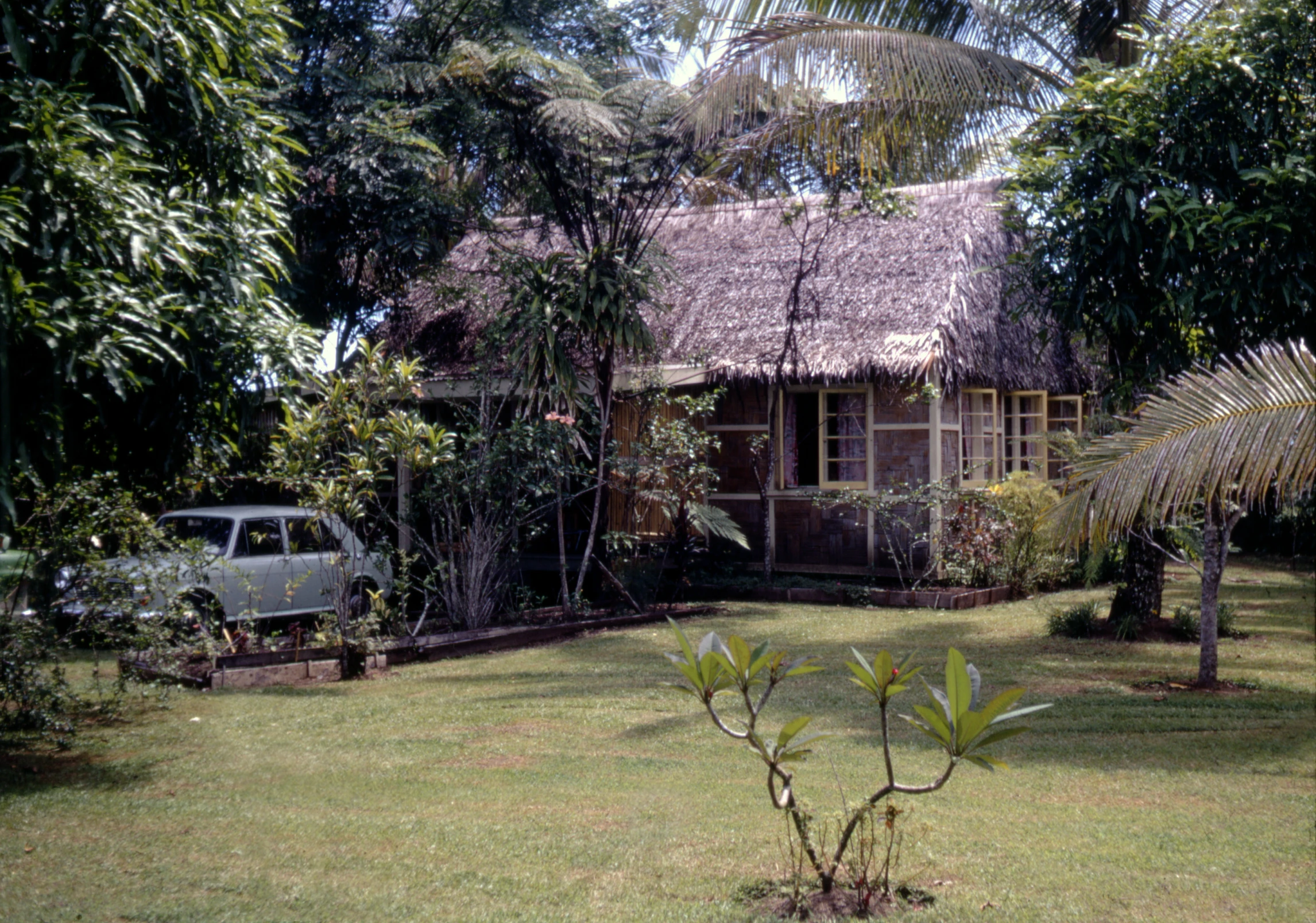 a car parked in front of a small house