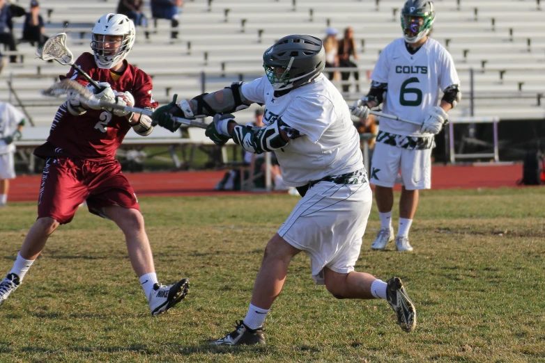 a lacrosse game is taking place on the field