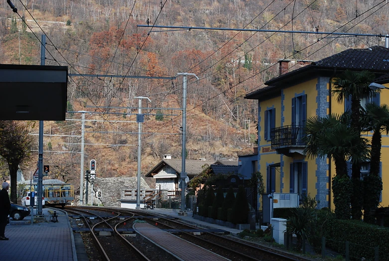 a view of a train tracks going through a town