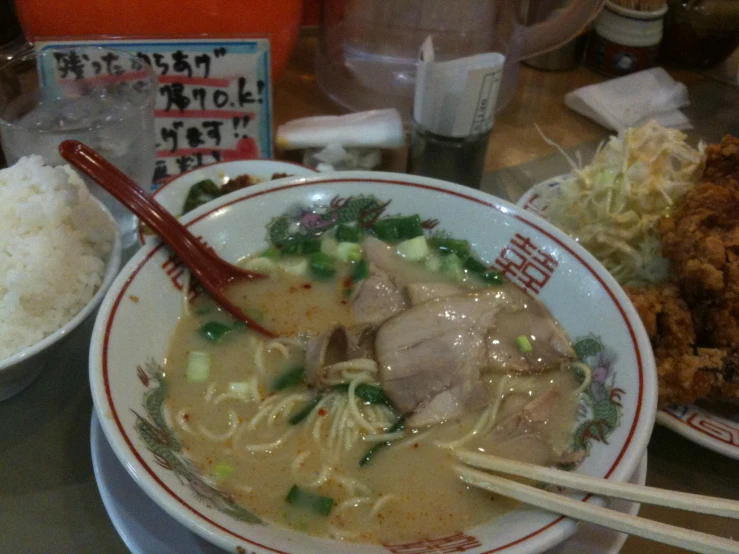 a bowl of noodles with a serving fork