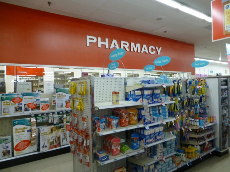 a pharmacy store with an overcrowing filled aisle