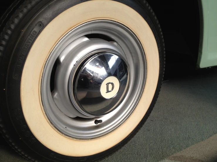 a car tire is pictured with a round badge