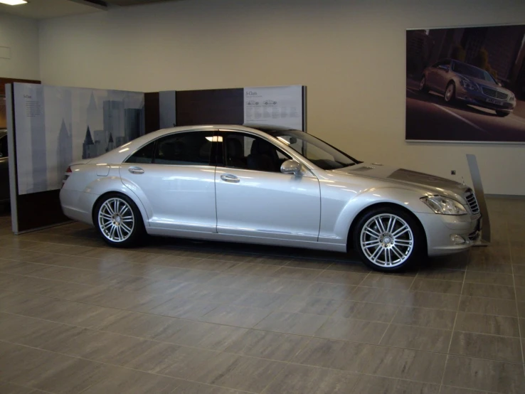 a white car parked in a showroom