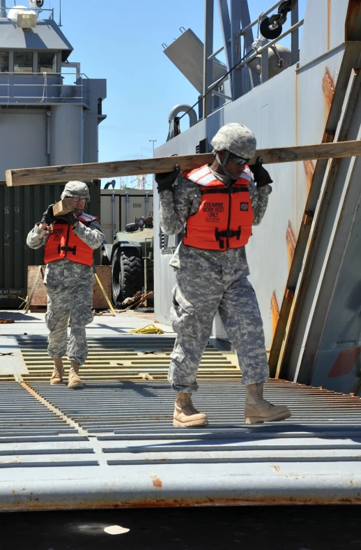 a couple of men standing on a dock near another man