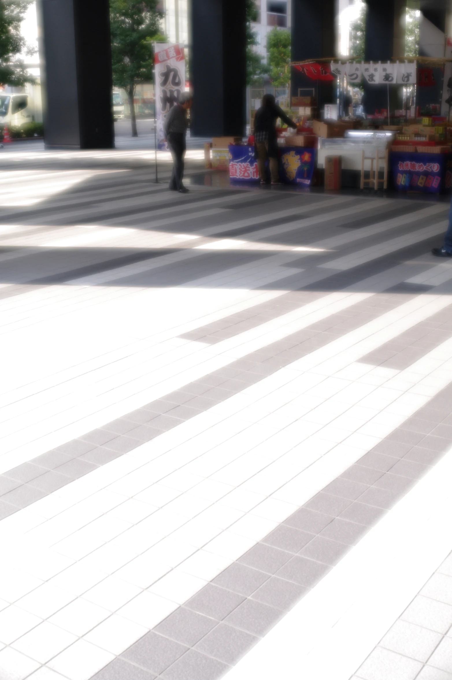 people are standing in front of food stands