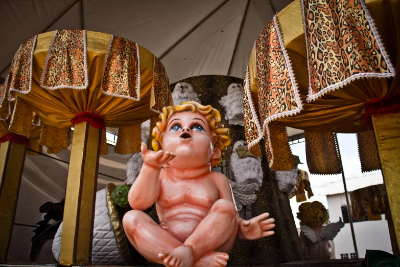 a baby figurine sitting on top of a table