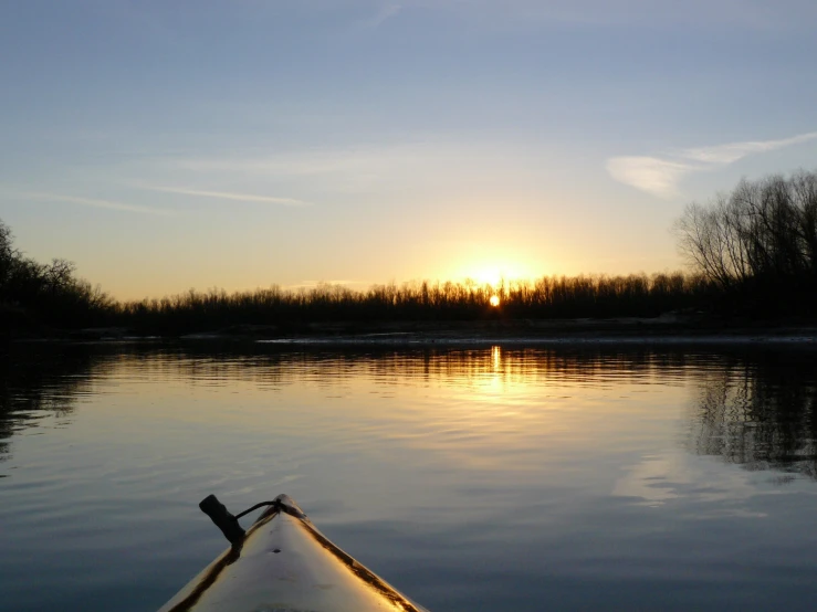 a view from the back of a kayak looking over water