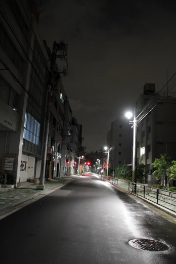 an empty street is shown during the night